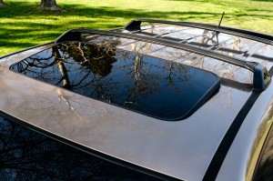 Brown  car SUV sunroof, hatch close-up
